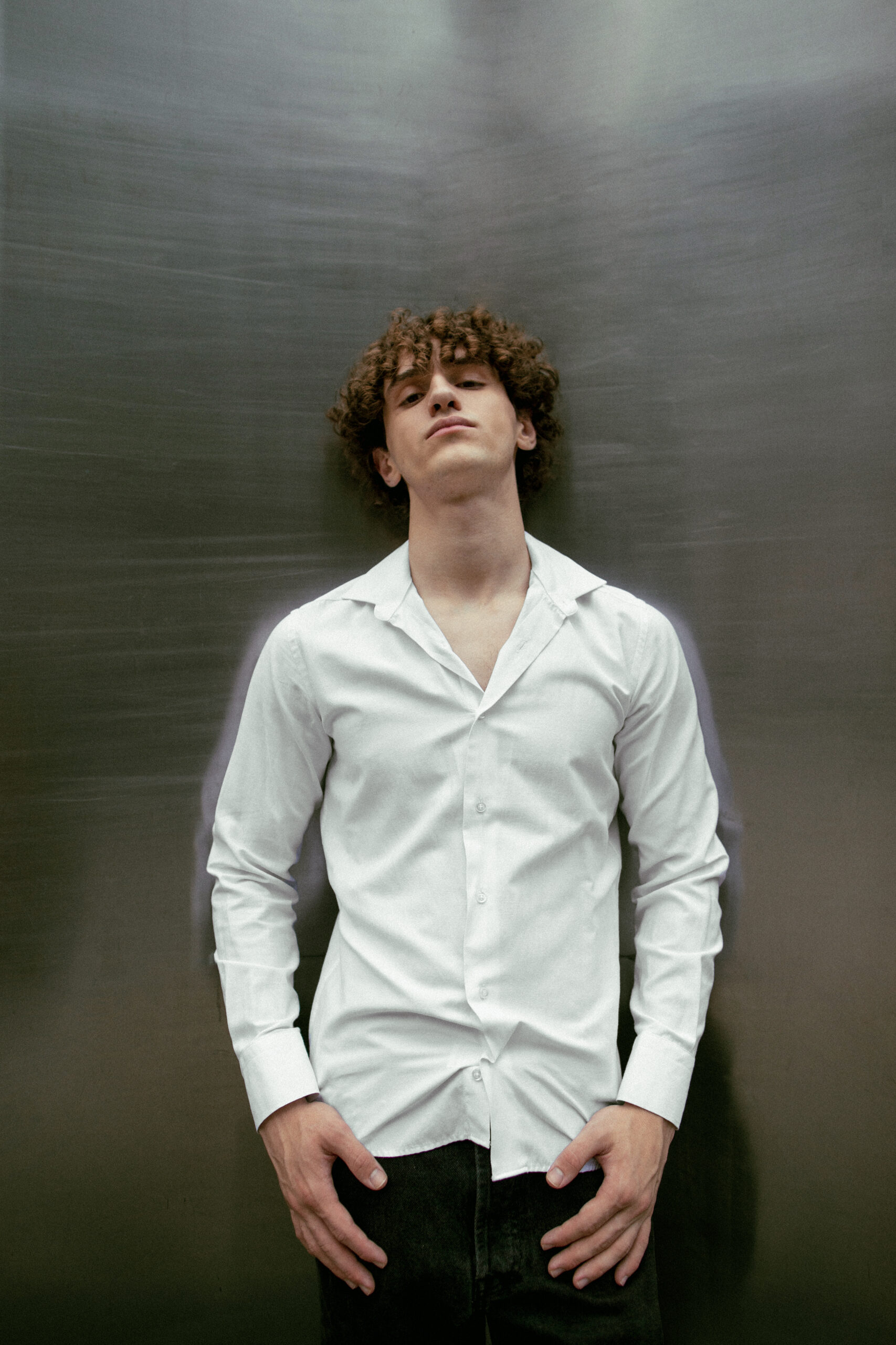 analog-portrait-handsome-man-posing-artistically-outdoors